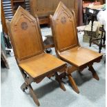 PAIR OAK MITRED CHURCH XCHAIRS BY W COUNTER