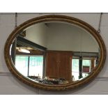 LARGE OVAL GILT FRAMED MIRROR