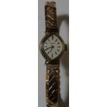 9CT GOLD CASED ROTARY LADIES WRISTWATCH ON AN EXPANDING BRACELET STRAP