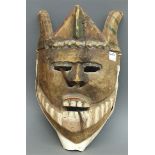 Holzmaske geschnitzt, Afrika, 20. Jh., h 33 cm,