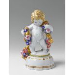 A large KPM porcelain figure of a putto with a garland A white glazed figure of a putto on a