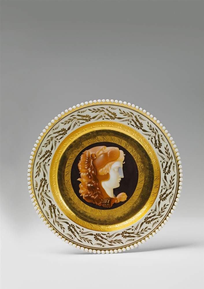 A plate with cameo painting made for Princess Louise The border decorated with gilt palmettes, the