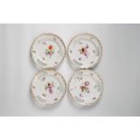 Four Berlin KPM porcelain dessert plates With an openwork border, decorated with bouquets and