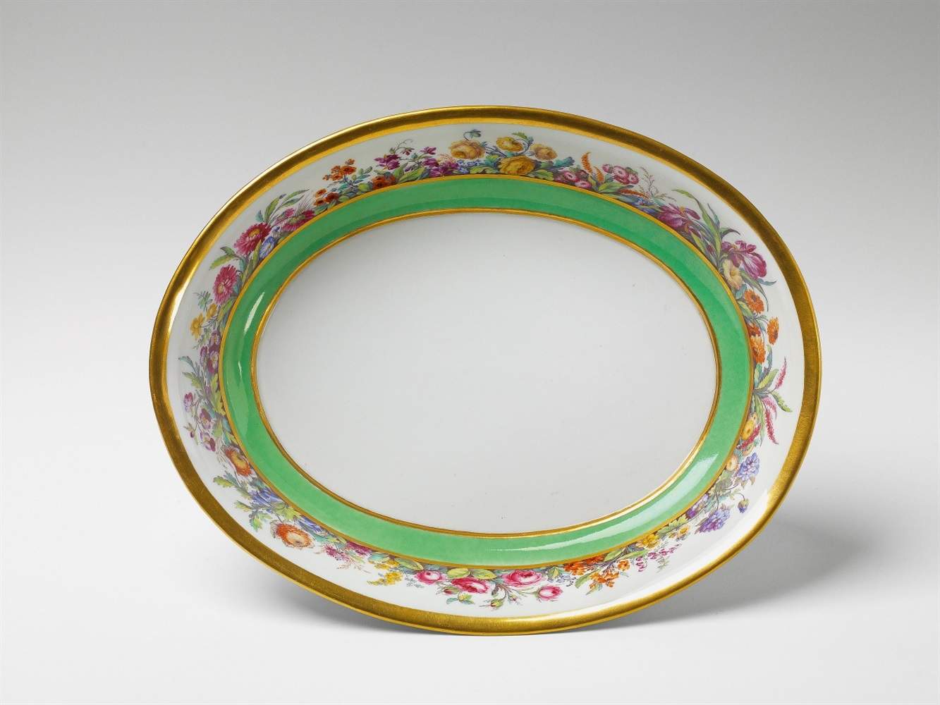 A Berlin KPM porcelain bowl with "fleurs en terrasse" An oval washbasin with finely painted floral