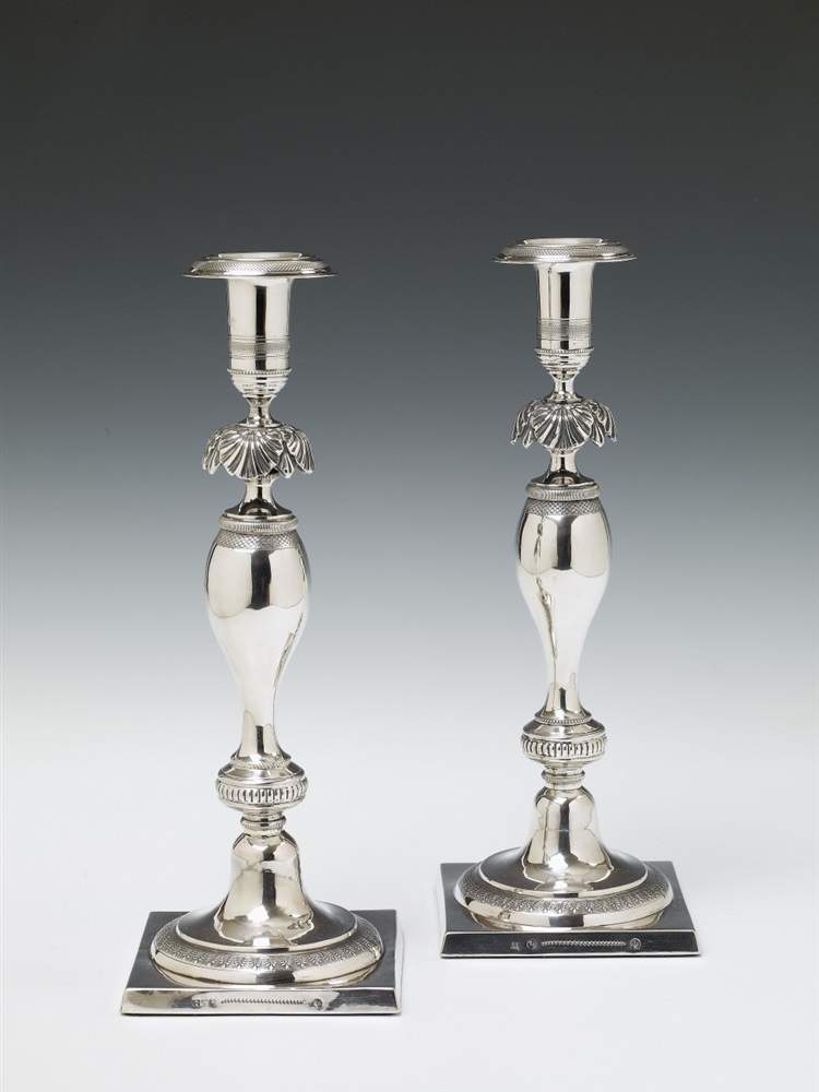 A pair of Berlin silver Biedermeier candlesticks. Marks of Johann George Wilhelm Heinicke, ca. 1830/