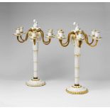A pair of ormolu mounted Berlin KPM porcelain candelabra from the "hochzeitszug" The shafts designed