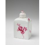 A Berlin KPM porcelain tea caddy with purple flower decor Blue sceptre mark. H 14 cm. Ca. 1775.