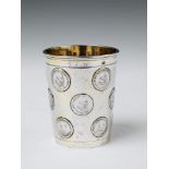 A Berlin partially gilt silver coin-set beaker. Set with 15 16th century Brandenburg coins bearing t