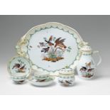 Pieces from a Berlin KPM porcelain tea service with native birds Comprising tray, coffee pot,