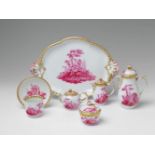 A Berlin KPM porcelain solitaire with mythological decor Comprising a tray, coffee pot, teapot,