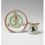 A Berin KPM porcelain cup and saucer with a silhouette portrait of Frederick II Monogrammed "FR"