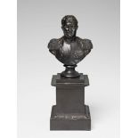 A black patinated cast iron bust of Napoleon A hole caused by the casting process to the cornice,