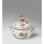 A round Berlin KPM porcelain tureen The finial formed as a little gardener boy with a basket of