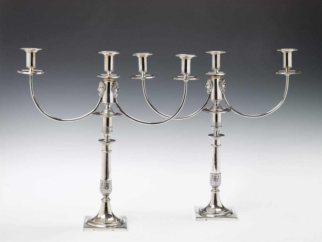 A pair of Berlin silver three-flame girandoles. Marks of Georg Wilhelm Lienemann, 1817 - 19. H 41