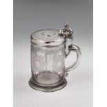 A Berlin silver and cut glass covered tankard. The lid inset with a Brunswick-Lüneburg taler dated 1
