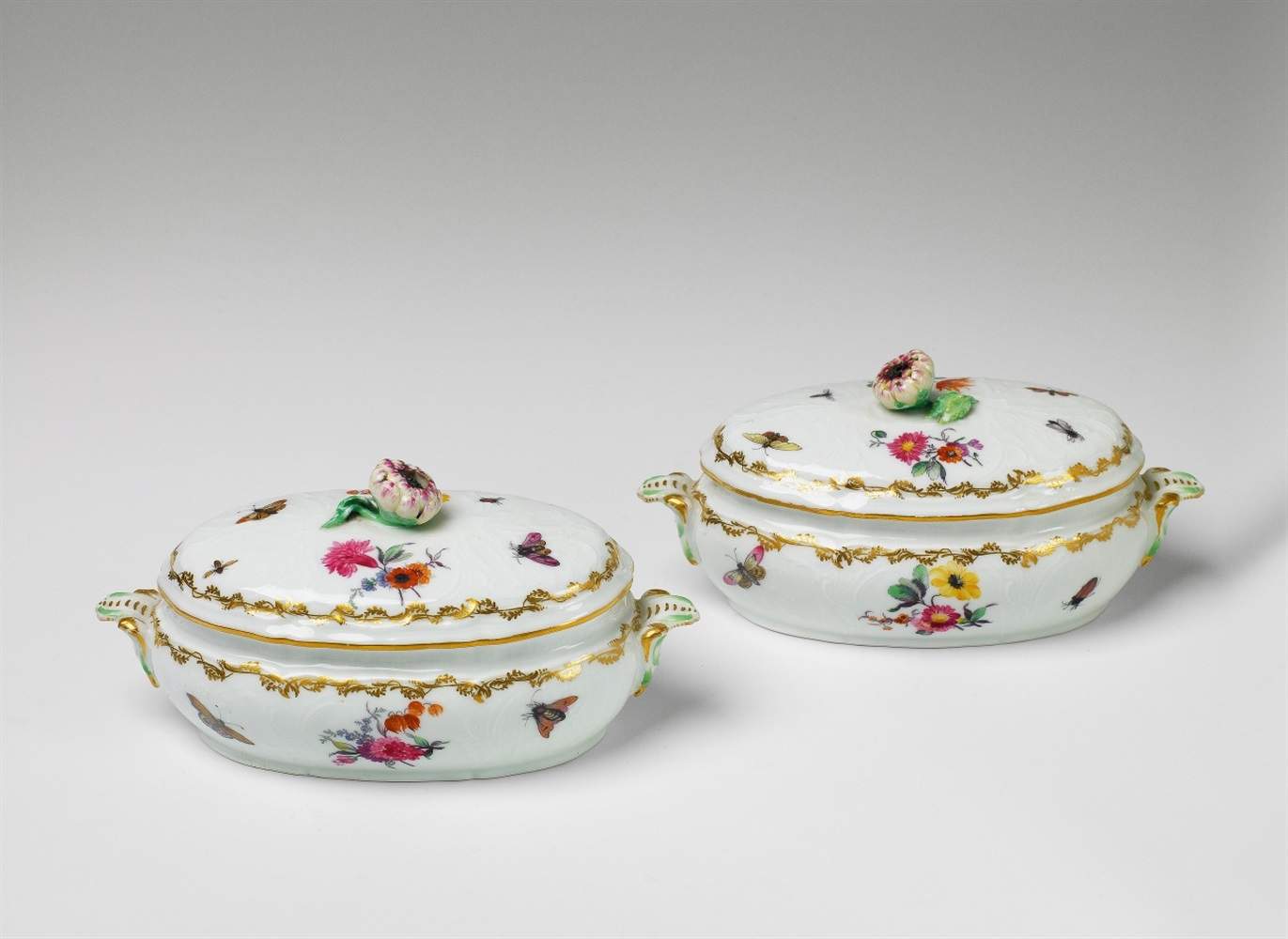 A pair of small Berlin KPM porcelain tureens Decorated with flowers and insects. Blue sceptre