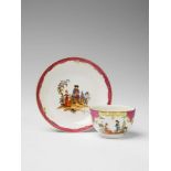 A Berlin KPM porcelain teacup and saucer with scenes after Teniers Decorated with pastoral couples