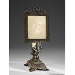 A black patinated cast iron night light with a KPM porcelain lithophane The lithophane with