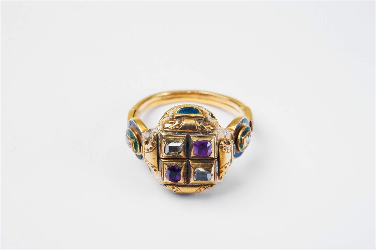 A rare gold, enamel, ruby and diamond "gimmel" ring with memento mori Formed from two connected
