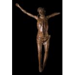 "Imposing figure of Christ on the cross". Carved wooden sculpture, with some faint remains of