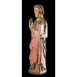 "Saint John". Carved, polychrome wooden sculpture. Romanesque. 13th century. The saint is dressed in