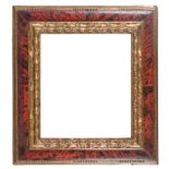Carved marbled and gilded frame. 17th century.