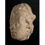 Sculpted limestone bishop’s head wearing a mitre with sculpted precious stones. France. 13th