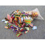 A bag of assorted medal ribbons, all sizes, part rolls, British, French, Belgian etc. A useful lot