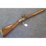 A Flintlock Musket converted from a Brown Bess to a short carbine. Barrel 16" with the two
