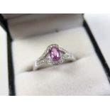 18ct White Gold Ring with central pink Sapphire surrounded by Diamonds size O weight 4.0 grams