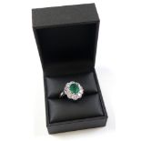 18ct White Gold Ring set with central 1.65 carat emerald surrounded by 10 Diamonds 1.50 carat weight