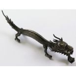 Silver Chinese dragon, circa 1900, marked on leg possibly 'WH' for Wang Hing & Co., weight 39.7g