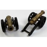 Pair cast iron model cannons with brass barrels, total length 35cm