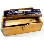 Drawing set in mahogany box (with key), containing numerous compasses, rulers etc