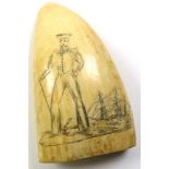 A 19th Century scrimshaw whale's tooth, engraved with sailor standing in front of a ship, length