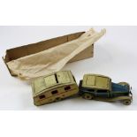 Mettoy tin plate clockwork car and caravan, 'TMC 9596' to either end of caravan, combined length