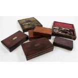 Seven drawing / compass sets, each in mahogany box, containing numerous compasses
