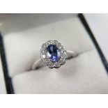 18ct White Gold Ring set with central 0.75 carat Tanzanite surrounded by Diamonds approx 0.40