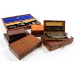Eight drawing / compass sets, each in mahogany box, containing numerous compasses