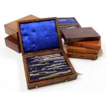 Eight drawing / compass sets, each in mahogany box, containing numerous compasses