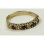 9ct Gold 9 stone CZ/Sapphire set Ring size O weight 2.2 grams