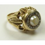 18ct Gold ring set with central pearl surrounded by Diamonds size Q weight 11 grams