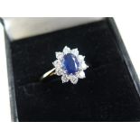 18ct Gold Ring with central Sapphire surrounded by Diamonds size N weight 3.0 grams