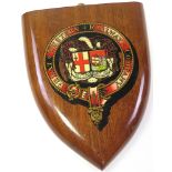 A shield shaped wooden plaque depicting The Great Western Railway Company motif