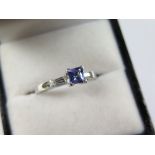 18ct White Gold Ring set with central Tanzanite with baguette Diamond shoulders size N weight 2.9