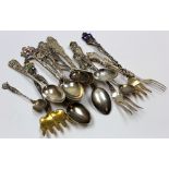 Eleven silver teaspoons and 4 silver forks. American, Canadian and British. Total wt. - 7oz (