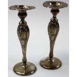 Two ornate silver candlesticks (show wear and one is repaired). Possibly continental marked 925/1000