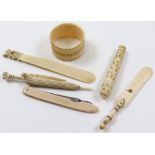 Collection of seven ivory items, including a napkin ring, a pen knife and two ivory page turners