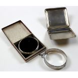 Three silver items - a silver cigarette case and 2 silver bangles, various dates. Weight - approx.