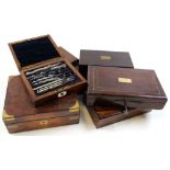 Seven drawing sets, each in walnut box, containing numerous compasses
